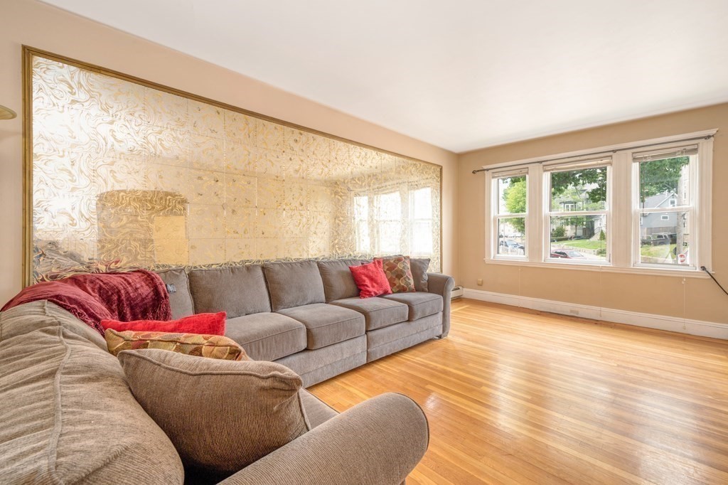 43 Ormond Street Boston, MA 02126 - Photo 12 of 30 a living room with furniture and a large window