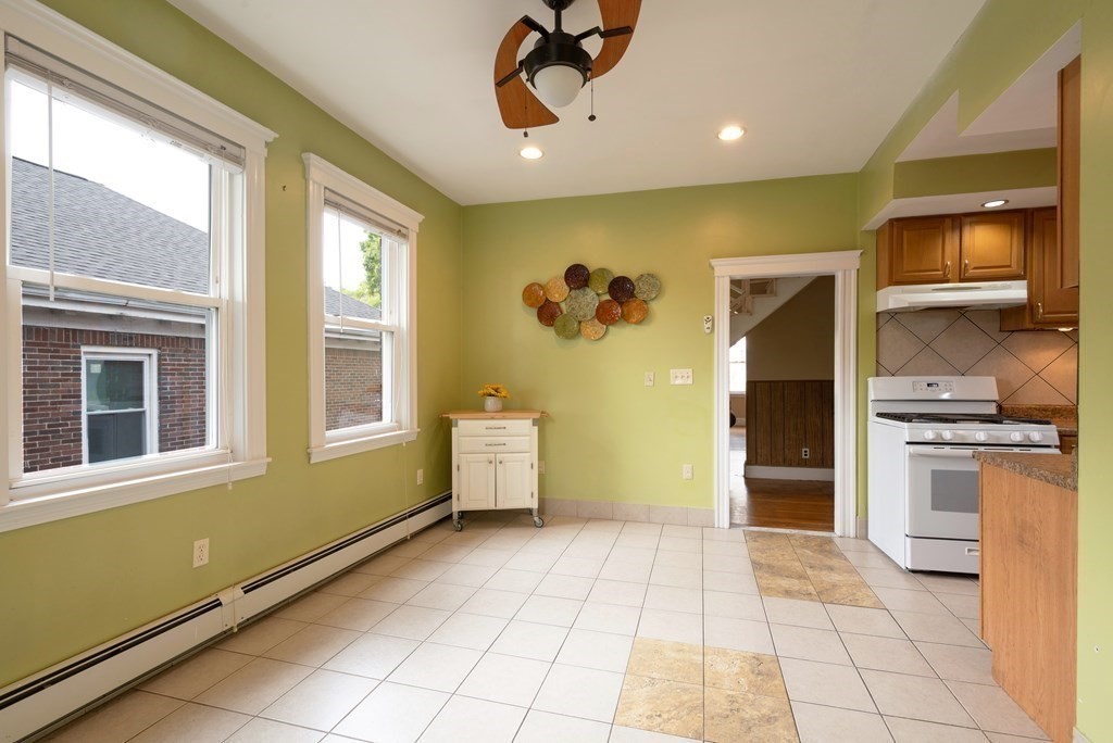 43 Ormond Street Boston, MA 02126 - Photo 16 of 30 a view of a kitchen with a sink and a refrigerator