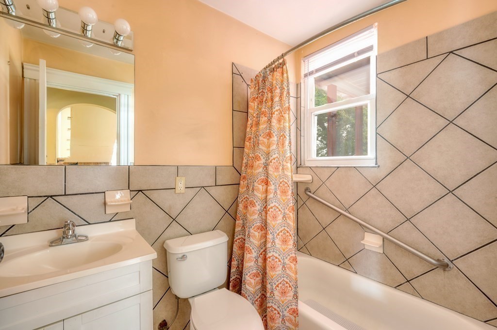 43 Ormond Street Boston, MA 02126 - Photo 19 of 30 a bathroom with a sink and a toilet