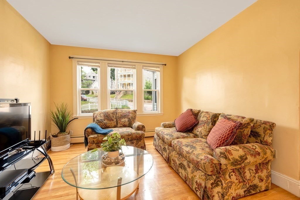 43 Ormond Street Boston, MA 02126 - Photo 2 of 30 a living room with furniture and a flat screen tv