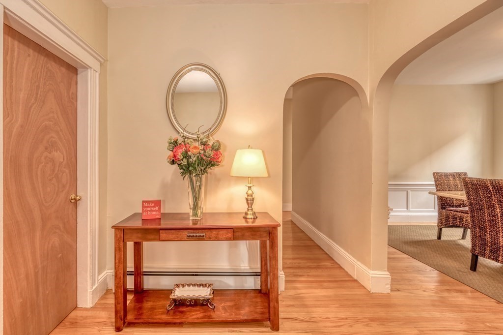 43 Ormond Street Boston, MA 02126 - Photo 4 of 30 a view of dining room filled with furniture and wooden floor