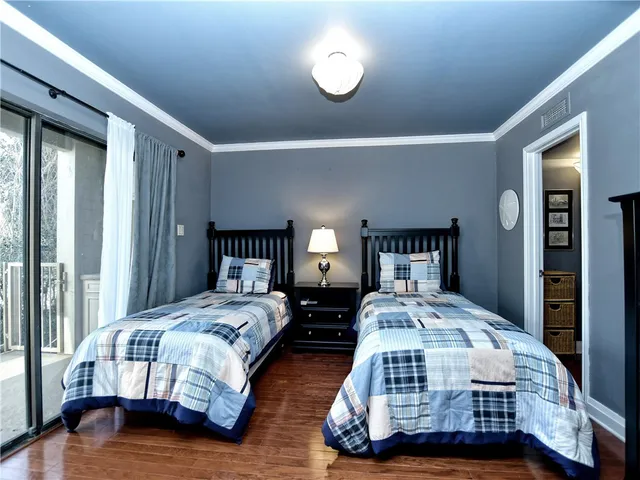 a bedroom with bed and a window