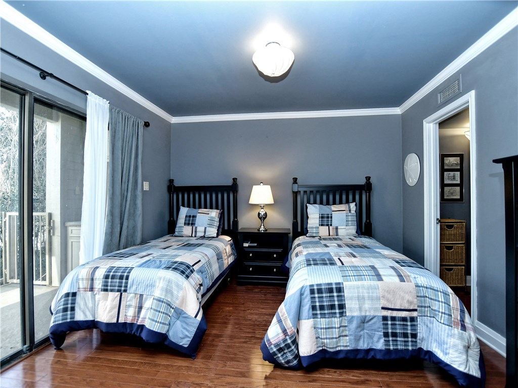 120 World Of Tennis Square, Unit 118C Lakeway, TX 78738 - Photo 14 of 29 a bedroom with bed and a window