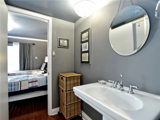 a bathroom with a double vanity sink and a mirror
