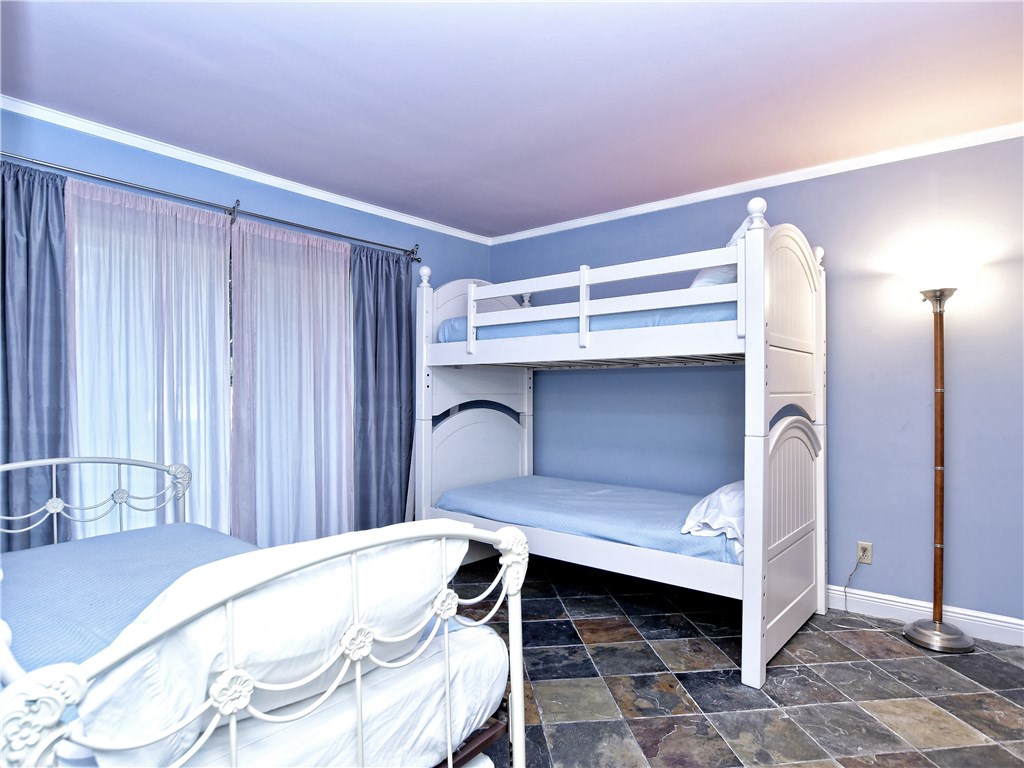 120 World Of Tennis Square, Unit 118C Lakeway, TX 78738 - Photo 18 of 29 a bedroom with a bed and a table