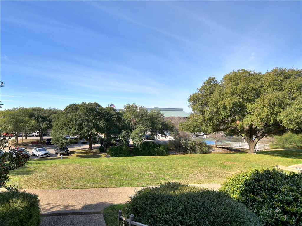 120 World Of Tennis Square, Unit 118C Lakeway, TX 78738 - Photo 2 of 29 a view of yard with swimming pool and green space