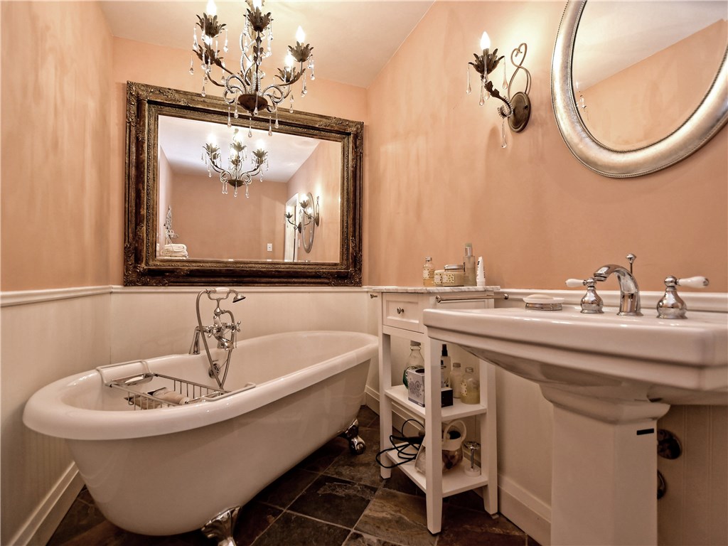 120 World Of Tennis Square, Unit 118C Lakeway, TX 78738 - Photo 21 of 29 a bathroom with a sink and a mirror