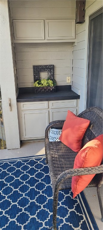 120 World Of Tennis Square, Unit 118C Lakeway, TX 78738 - Photo 24 of 29 a kitchen with a stove and a cabinet