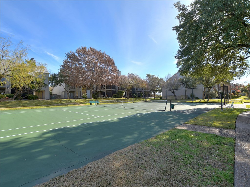 120 World Of Tennis Square, Unit 118C Lakeway, TX 78738 - Photo 26 of 29 a view of a ground with large trees