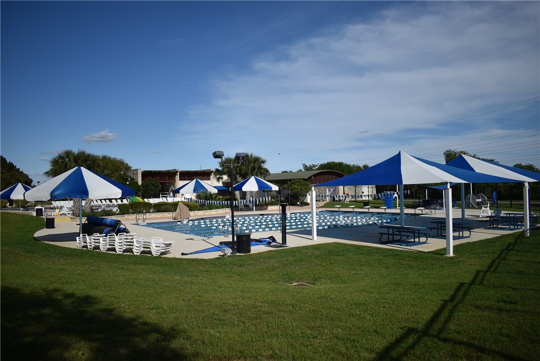 120 World Of Tennis Square, Unit 118C Lakeway, TX 78738 - Photo 28 of 29 a view of a house with a backyard porch and sitting area