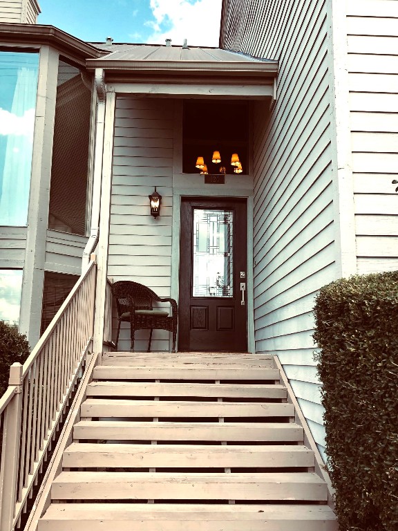 120 World Of Tennis Square, Unit 118C Lakeway, TX 78738 - Photo 29 of 29 a view of a house with a door and a balcony