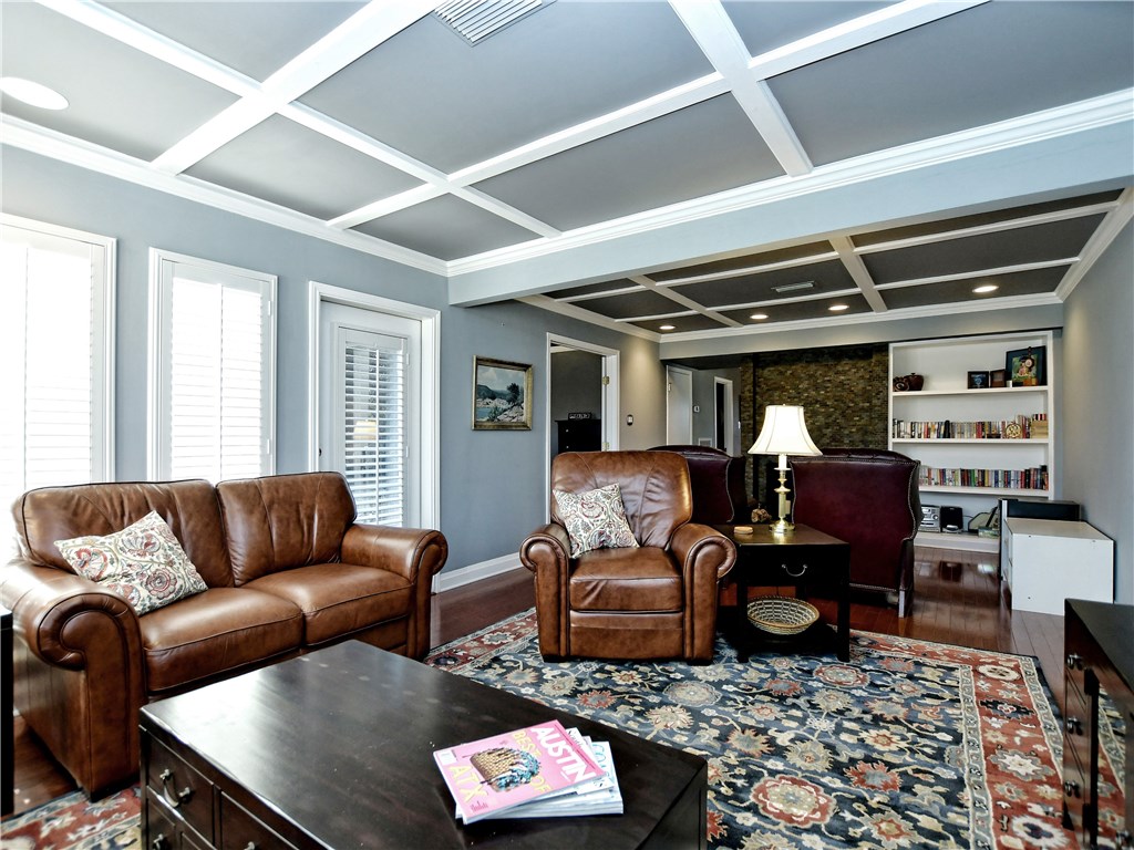120 World Of Tennis Square, Unit 118C Lakeway, TX 78738 - Photo 4 of 29 a living room with furniture a rug and a window