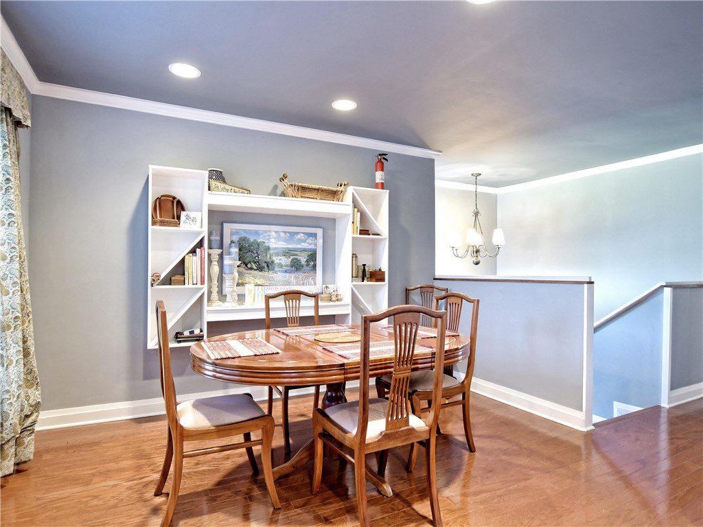120 World Of Tennis Square, Unit 118C Lakeway, TX 78738 - Photo 8 of 29 a dining room with furniture and window