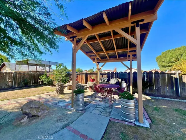 a view of a backyard with sitting area