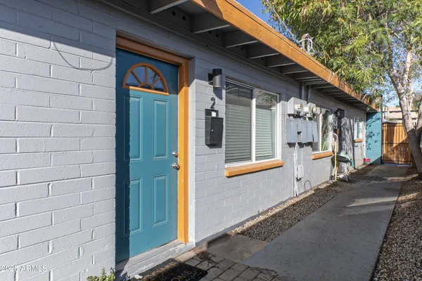 a front view of a house with an outdoor space