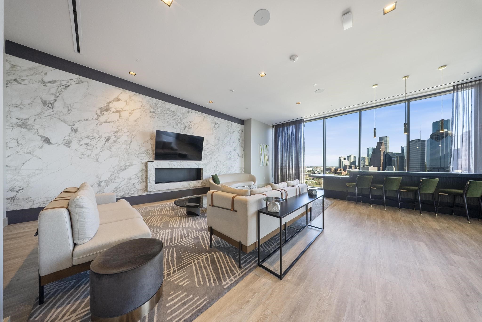 1711 Allen Parkway, Unit 1802 Houston, TX 77019 - Photo 19 of 28 a living room with furniture and a flat screen tv
