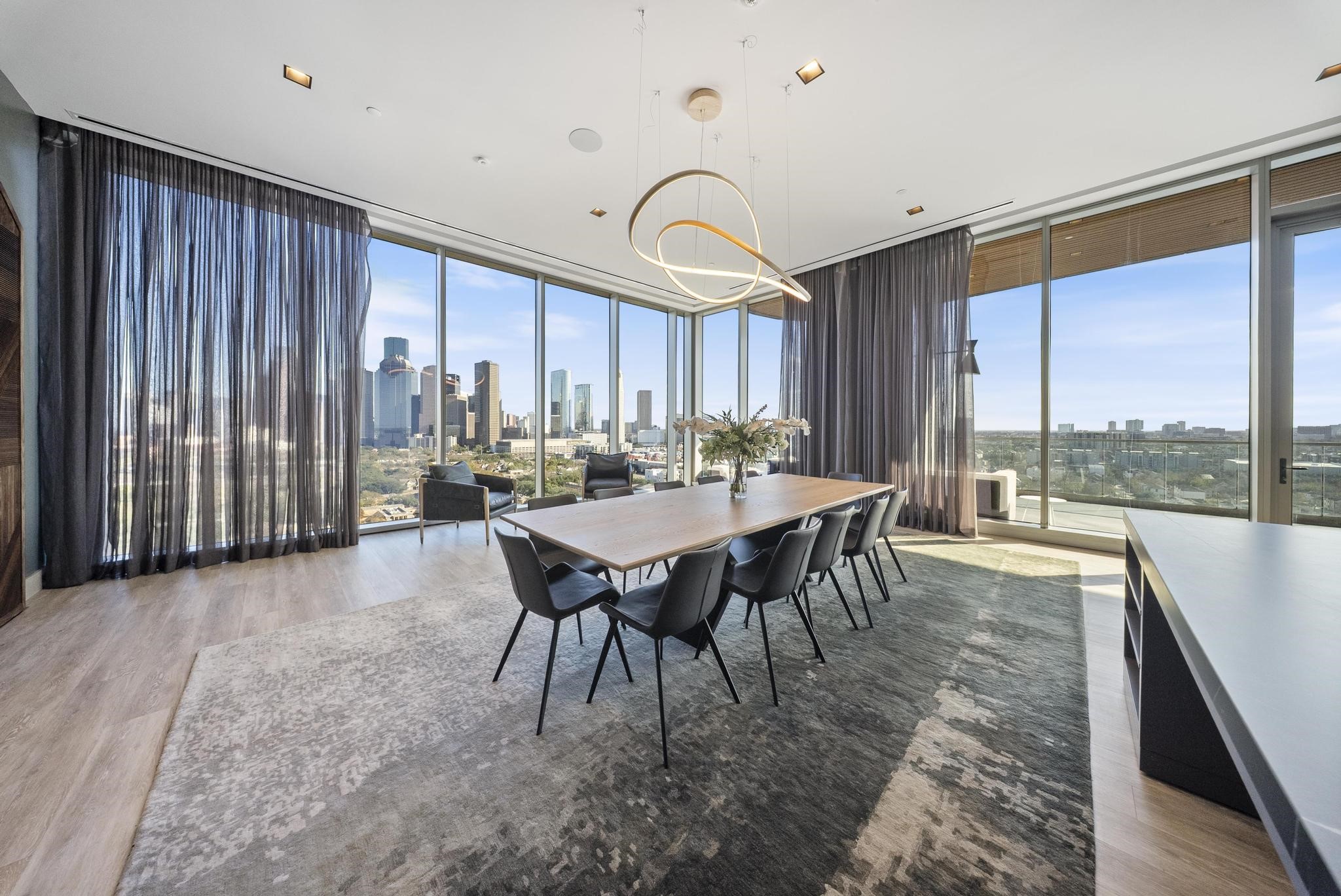 1711 Allen Parkway, Unit 1802 Houston, TX 77019 - Photo 20 of 28 a view of a dining room with furniture window and outside view