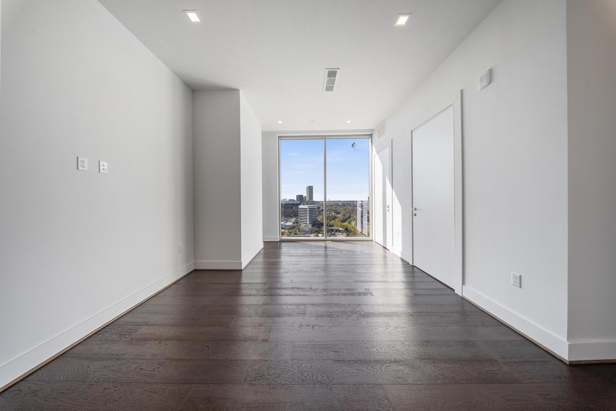 1711 Allen Parkway, Unit 1802 Houston, TX 77019 - Photo 4 of 28 a view of a kitchen with wooden floor and a window