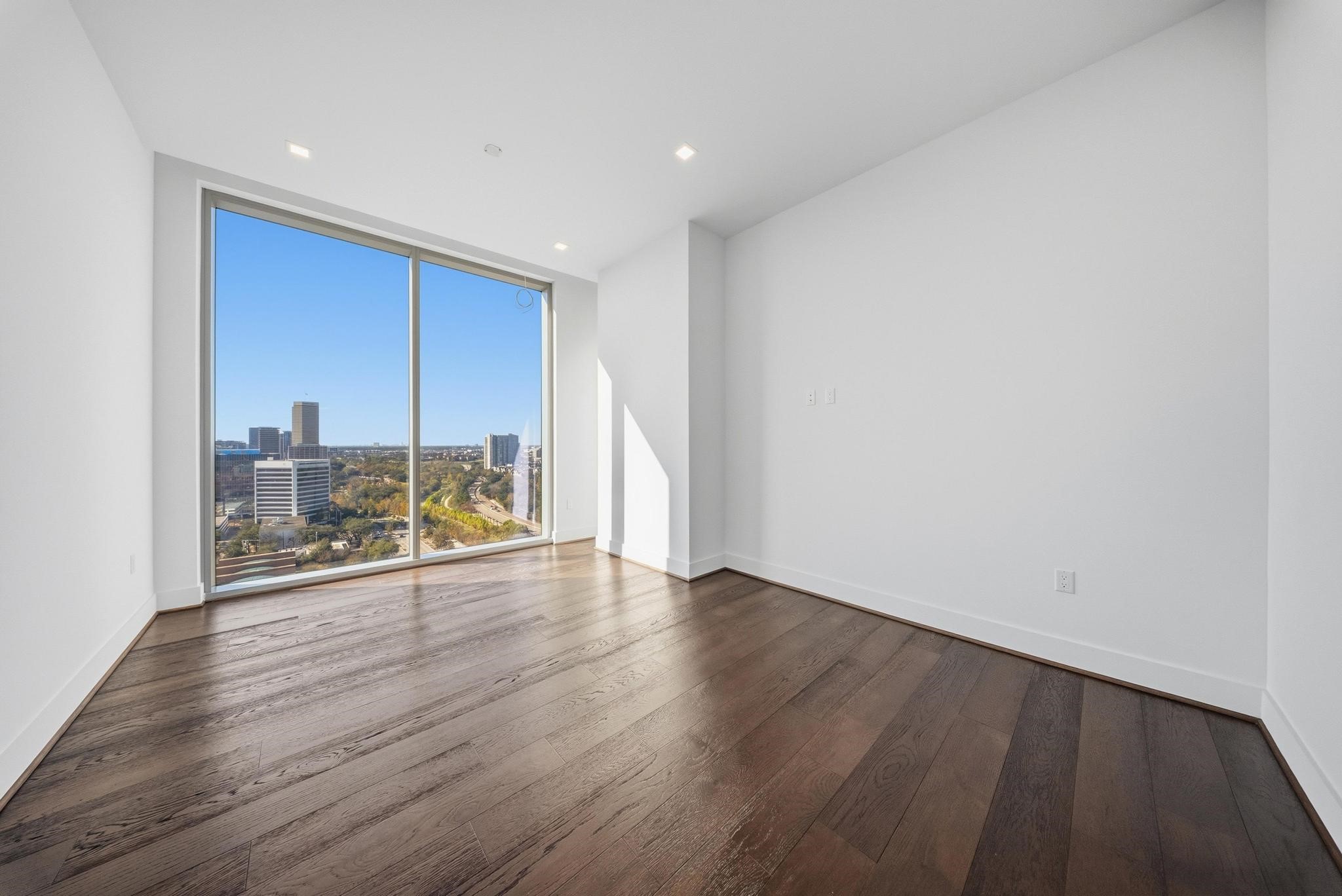 1711 Allen Parkway, Unit 1802 Houston, TX 77019 - Photo 5 of 28 a view of a large window with wooden floor