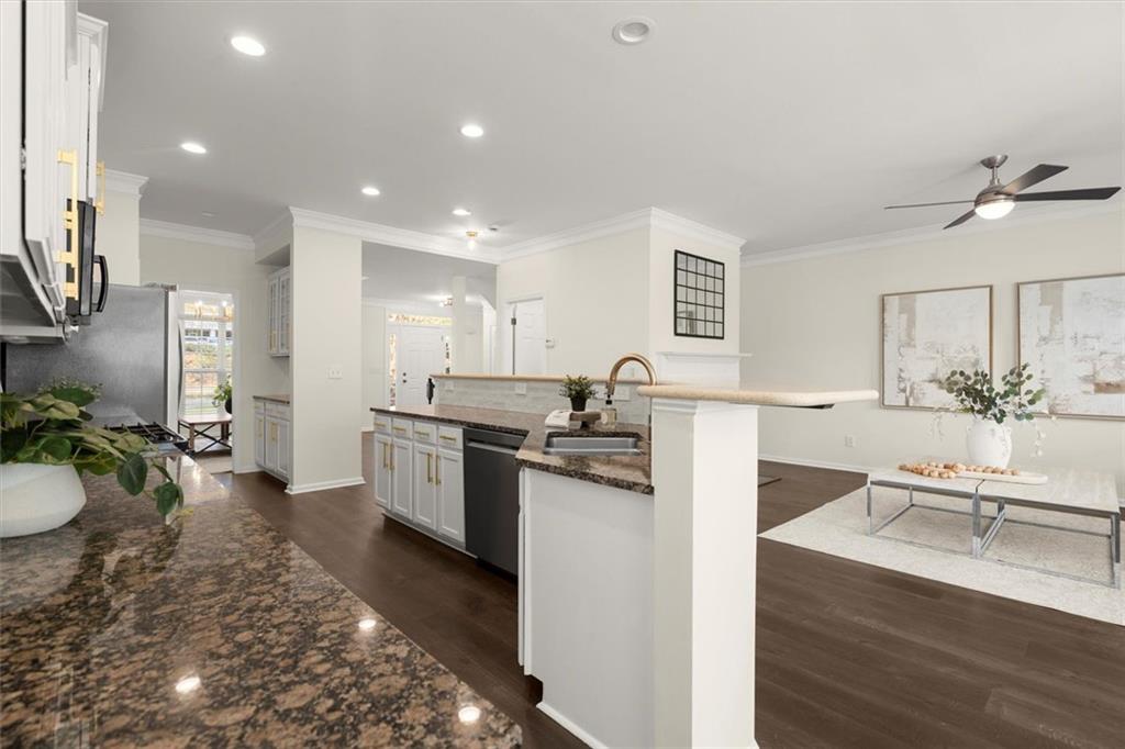 3196 Buck Way Alpharetta, GA 30004 - Photo 11 of 53 a view of a kitchen with kitchen island a sink stainless steel appliances and cabinets