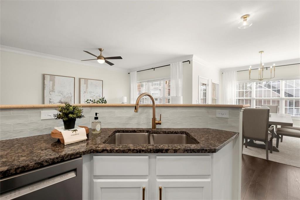 3196 Buck Way Alpharetta, GA 30004 - Photo 12 of 53 a kitchen with a sink and cabinets