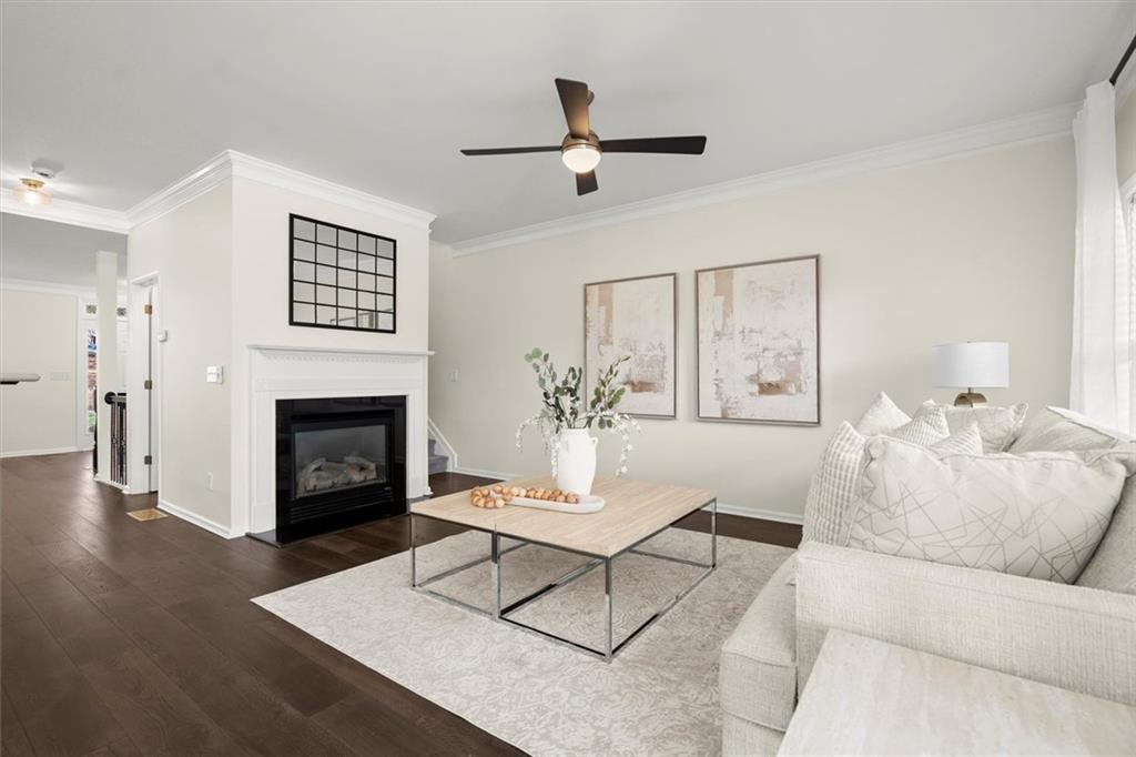 3196 Buck Way Alpharetta, GA 30004 - Photo 19 of 53 a living room with furniture and a fireplace