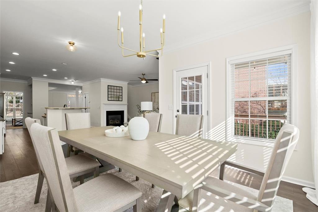 3196 Buck Way Alpharetta, GA 30004 - Photo 23 of 53 a view of a dining room with furniture and wooden floor