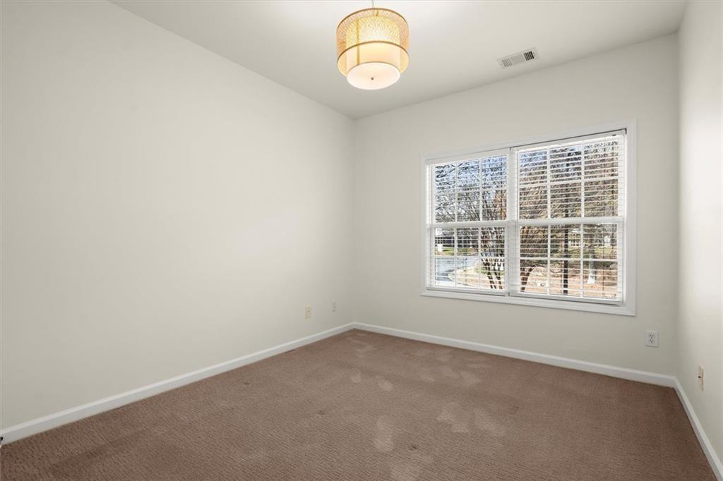 3196 Buck Way Alpharetta, GA 30004 - Photo 29 of 53 an empty room with wooden floor and windows