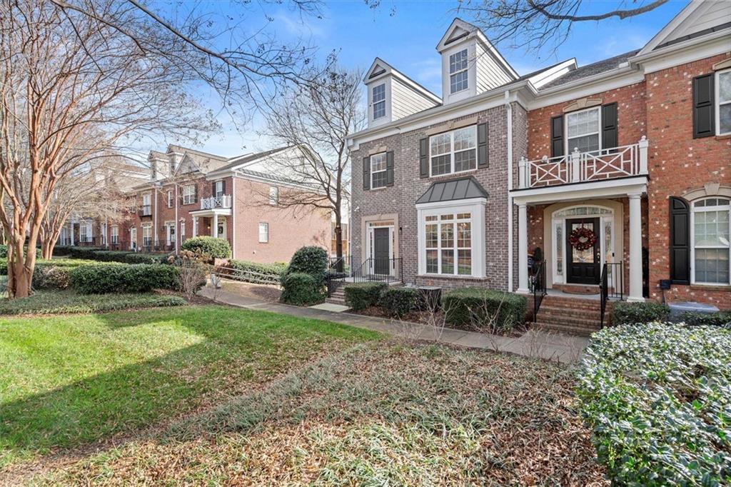 3196 Buck Way Alpharetta, GA 30004 - Photo 3 of 53 a front view of a house with garden and porch