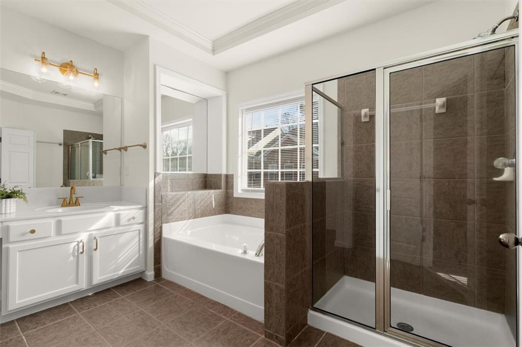 3196 Buck Way Alpharetta, GA 30004 - Photo 37 of 53 a large bedroom with a large bed and a glass door shower