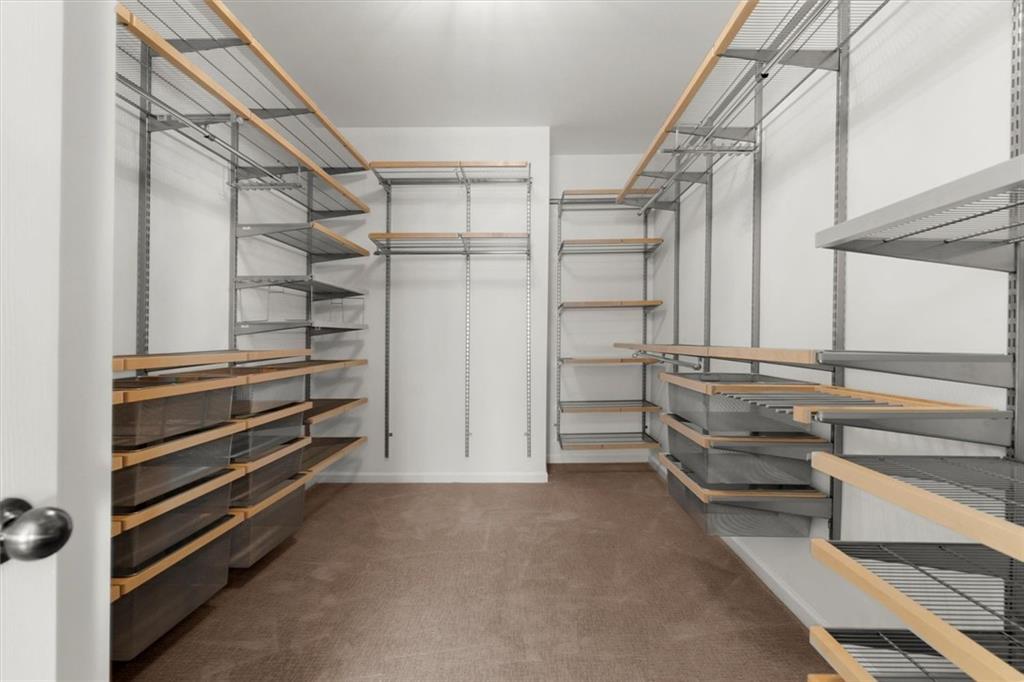 3196 Buck Way Alpharetta, GA 30004 - Photo 40 of 53 a view of walk in closet with empty racks