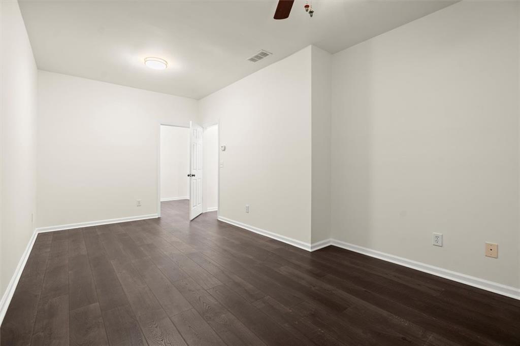3196 Buck Way Alpharetta, GA 30004 - Photo 43 of 53 a view of an empty room with wooden floor