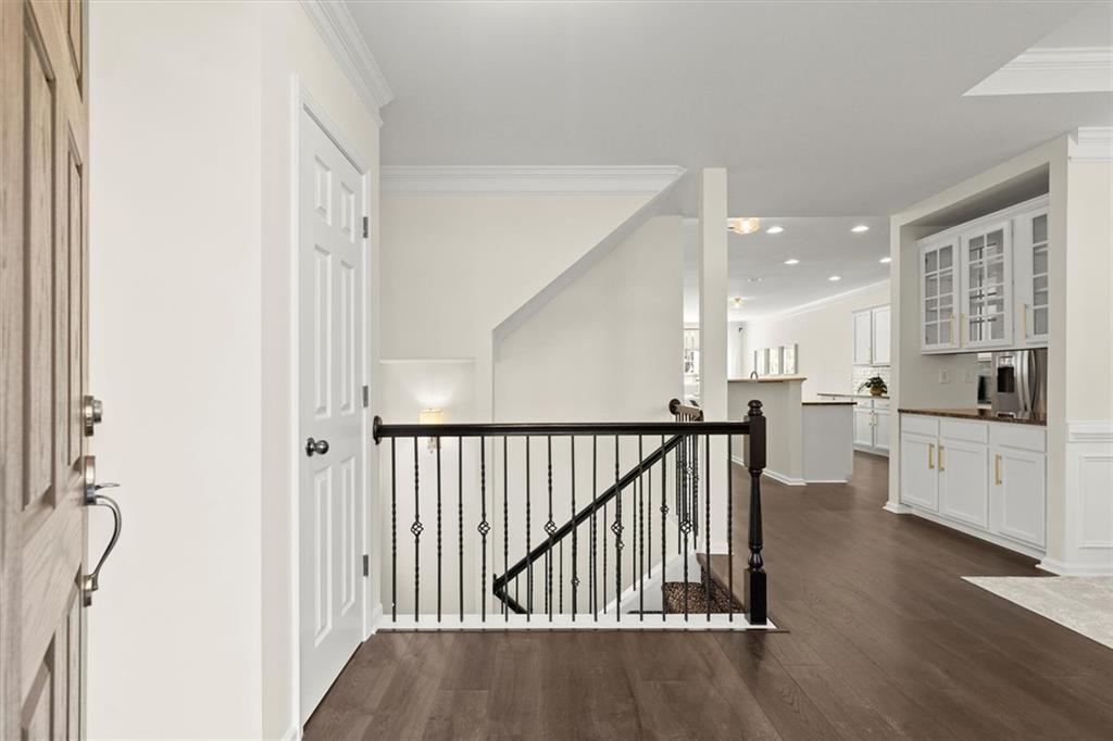 3196 Buck Way Alpharetta, GA 30004 - Photo 5 of 53 a view of a hallway with the wooden floor and staircase