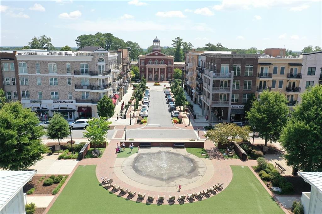 3196 Buck Way Alpharetta, GA 30004 - Photo 51 of 53 a view of a building with a yard and potted plants