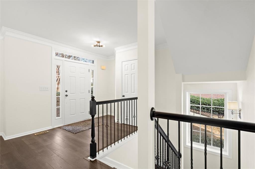 3196 Buck Way Alpharetta, GA 30004 - Photo 6 of 53 a view of a hallway with wooden floor and a window