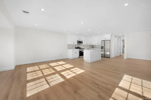a kitchen with a sink and a stove top oven