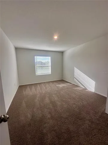 an empty room with a empty space and window