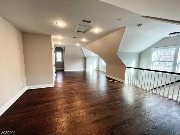 a view of gallery with wooden floor