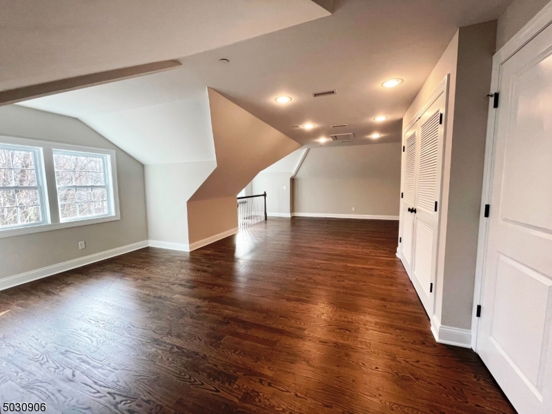 7 North Ridge Circle East Hanover, NJ 07936 - Photo 20 of 25 an empty room with wooden floor and windows