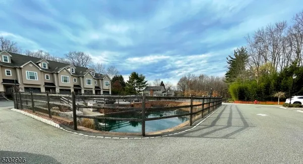 a view of swimming pool with outdoor seating and plants