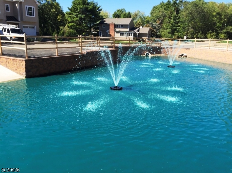 7 North Ridge Circle East Hanover, NJ 07936 - Photo 23 of 25 a view of a swimming pool with lawn chairs and plants