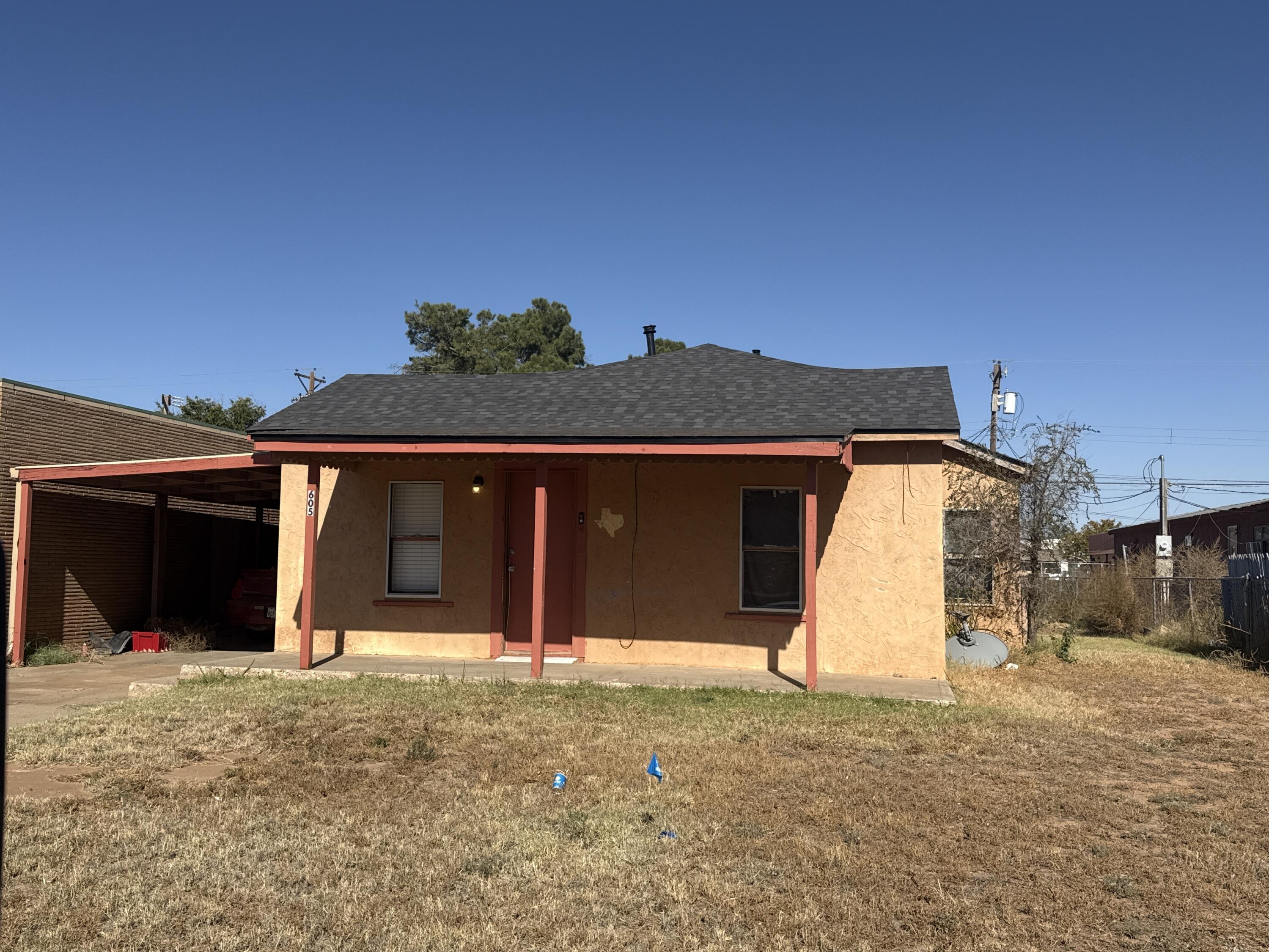 201 Maple Street Levelland, TX 79336 - Photo 5 of 10 a view of a house with a yard