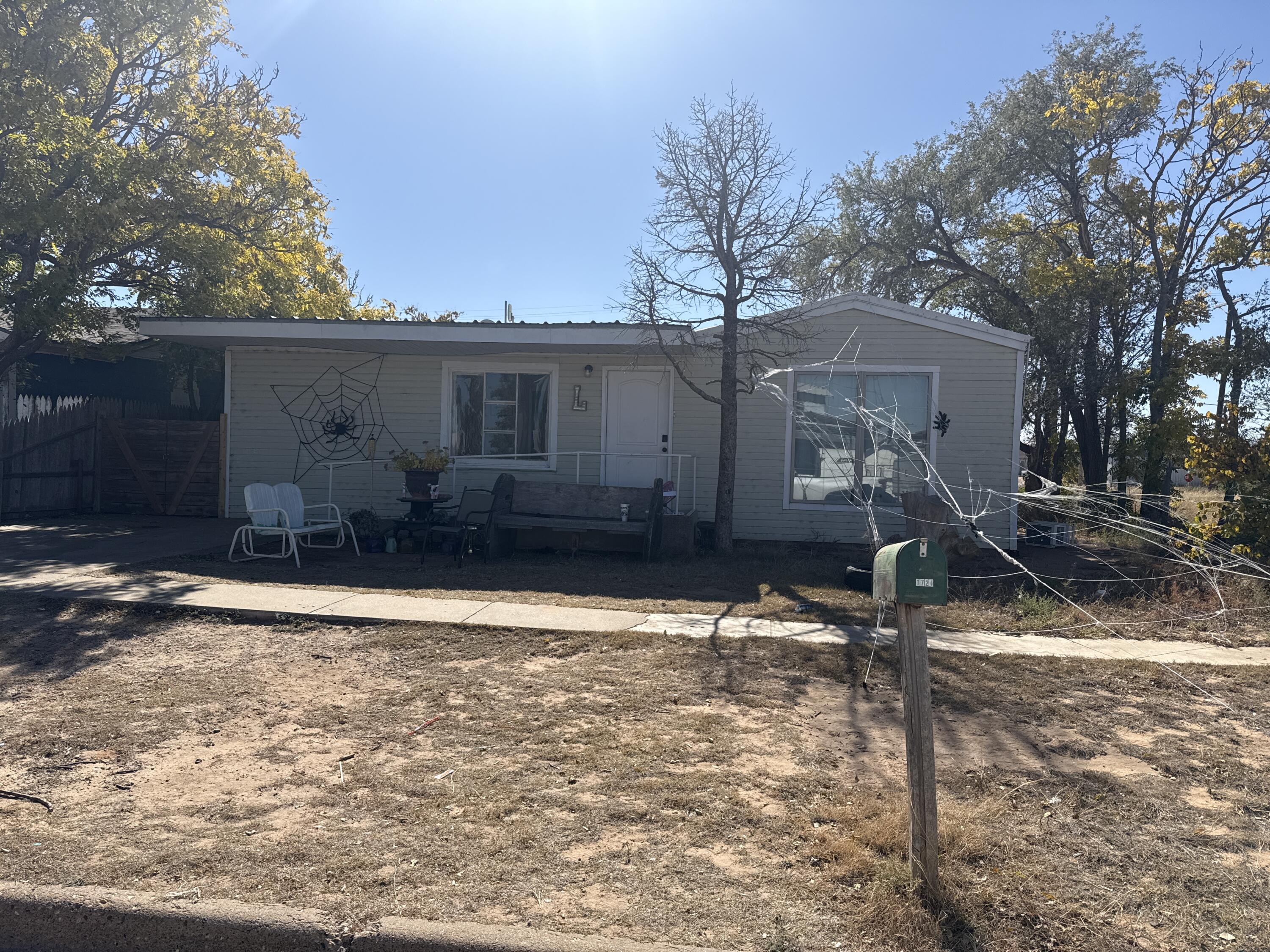 201 Maple Street Levelland, TX 79336 - Photo 6 of 10 a house view with a backyard space