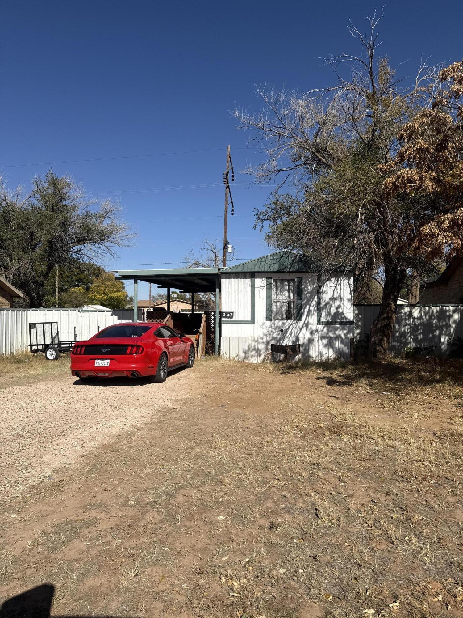 201 Maple Street Levelland, TX 79336 - Photo 8 of 10 a view of street with parked cars