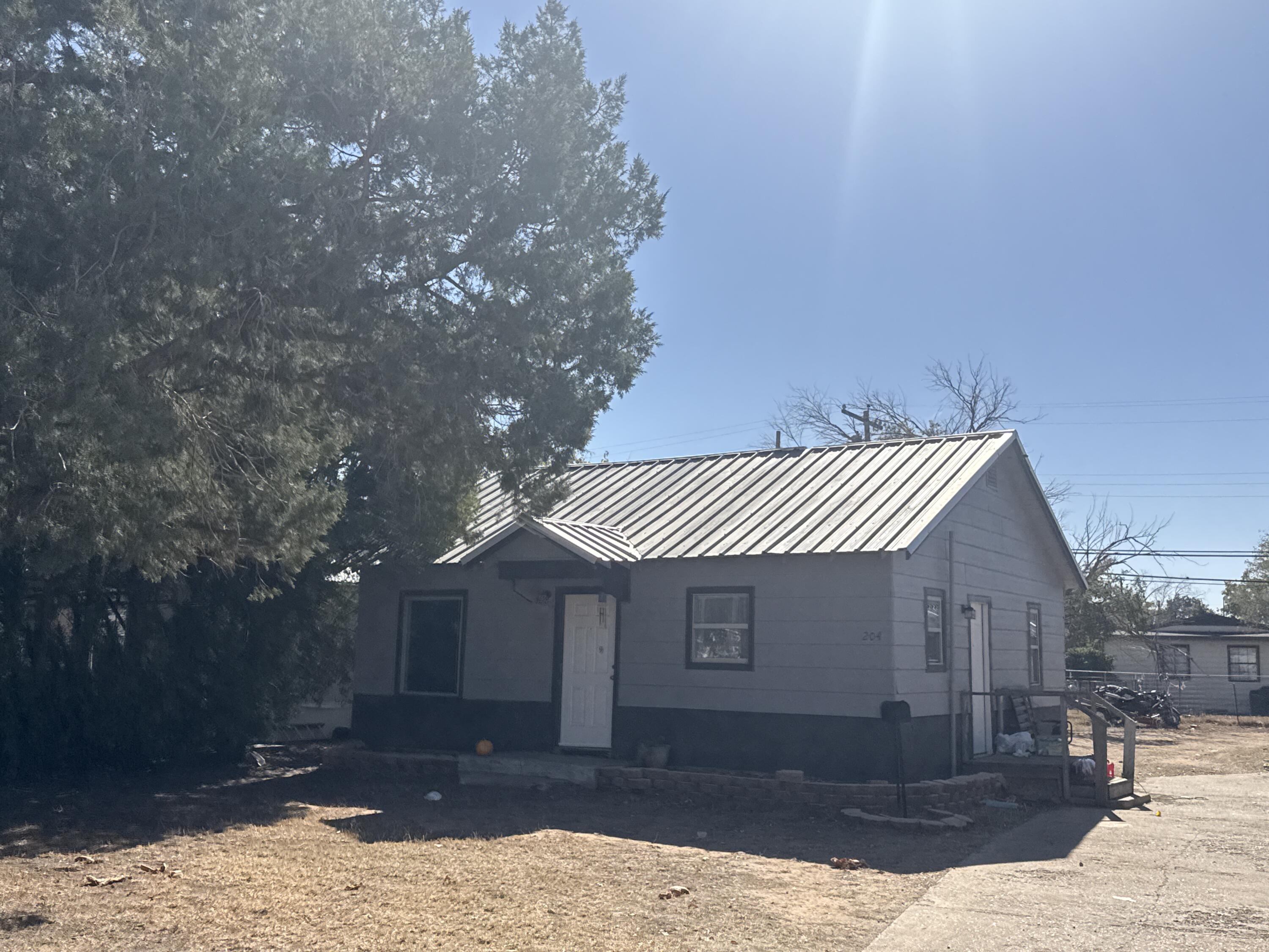 201 Maple Street Levelland, TX 79336 - Photo 9 of 10 a front view of a house with a yard