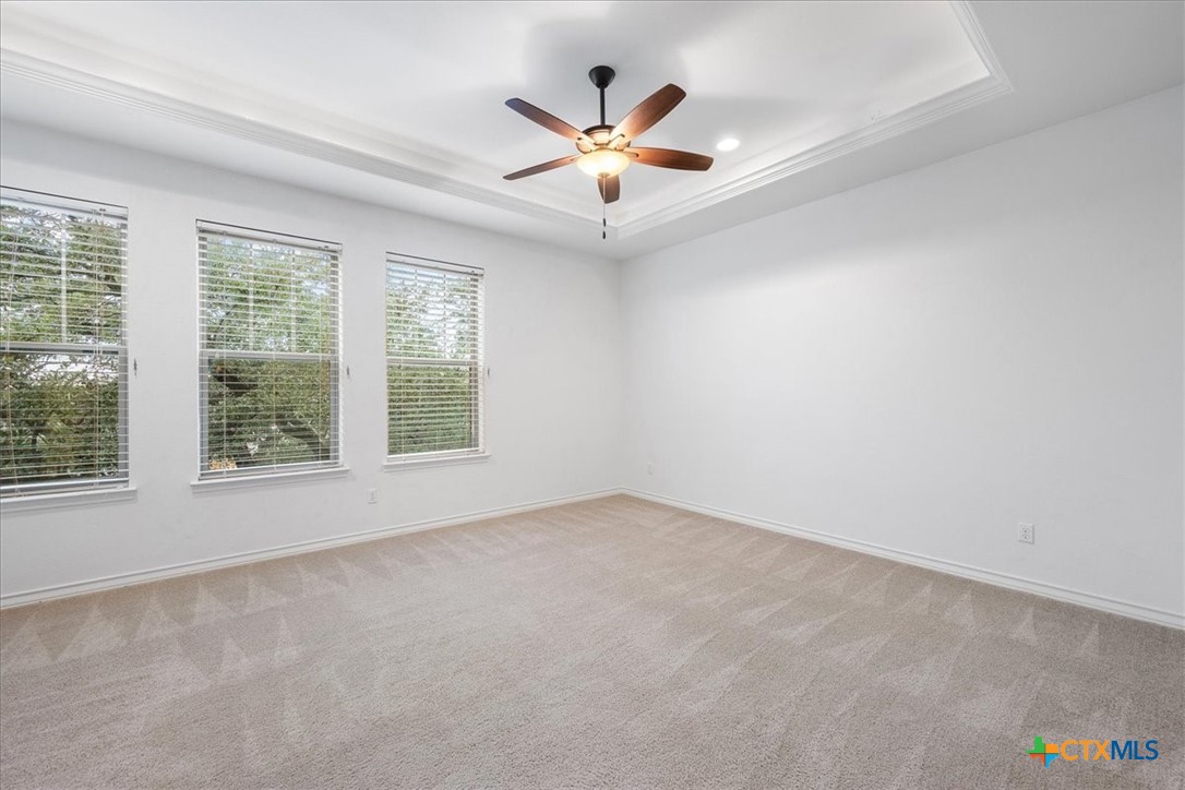 1009 Highknoll Lane Georgetown, TX 78628 - Photo 16 of 38 an empty room with ceiling fan and window