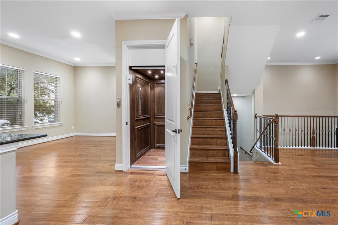 1009 Highknoll Lane Georgetown, TX 78628 - Photo 2 of 38 a view of entryway with wooden floor