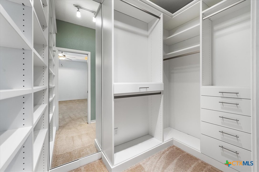 1009 Highknoll Lane Georgetown, TX 78628 - Photo 21 of 38 a view of walk in closet with empty racks