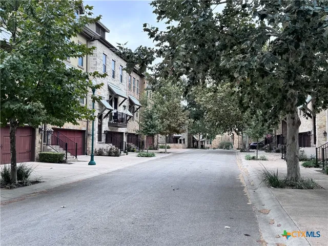 a view of a street with houses