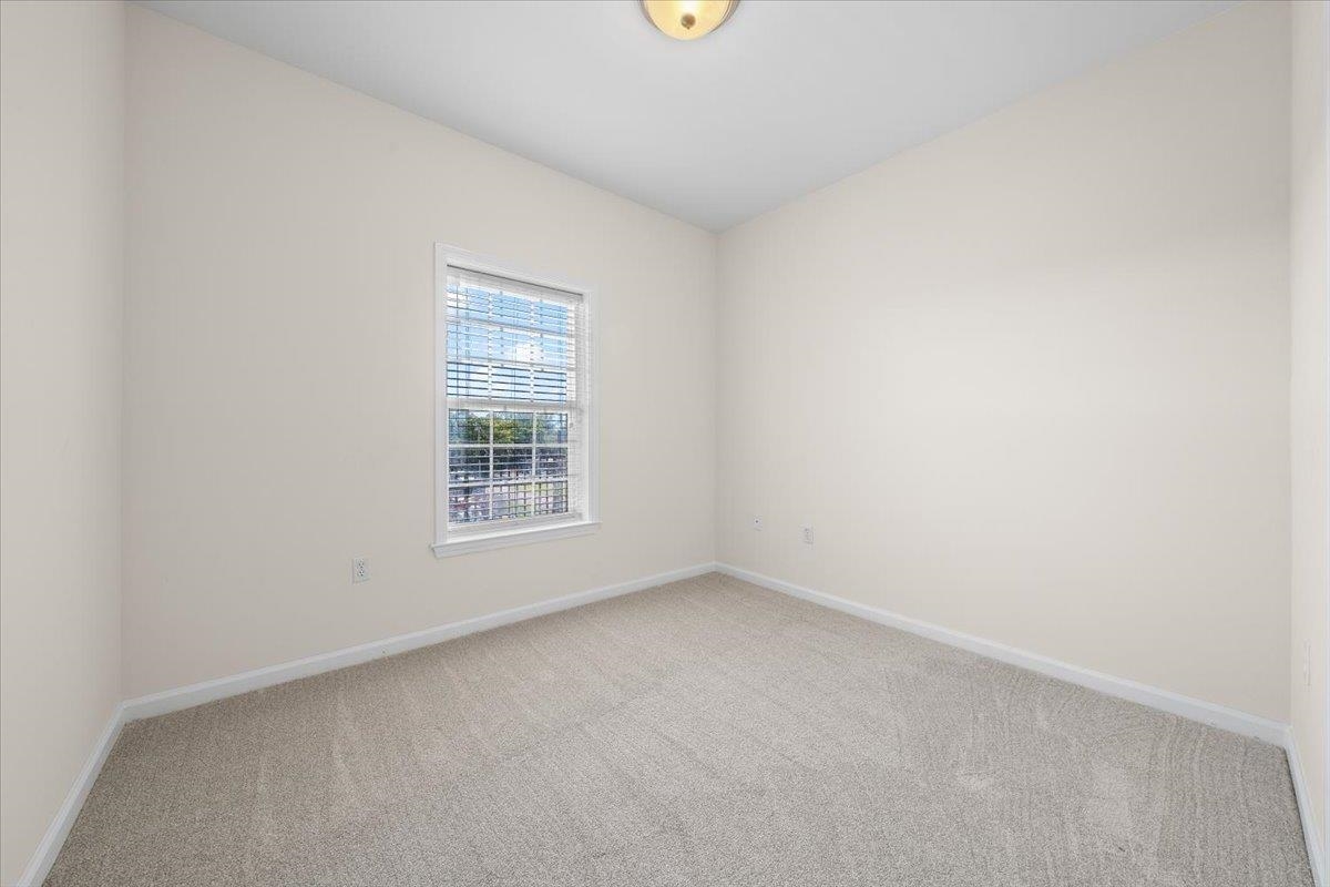 665 Tennessee Street, Unit 411 Memphis, TN 38103 - Photo 17 of 29 a view of an empty room with a window